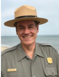 Profile picture of a ranger in front of a body of water