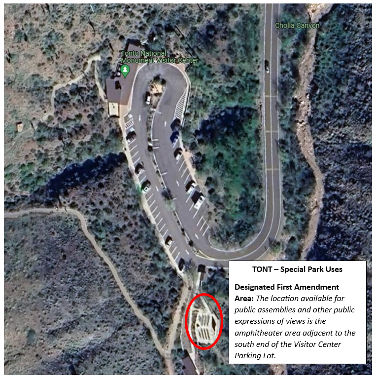 Tonto National Monument visitor center and parking lot seen from above. Tonto National Monument's designated free speech zone is indicated with a circle at the far end of the parking lot from the visitor center.