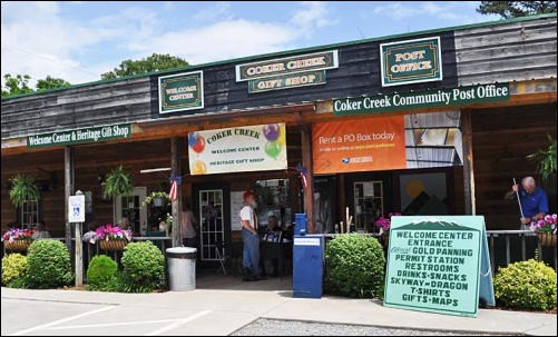 One story building entrance with multiple signs.