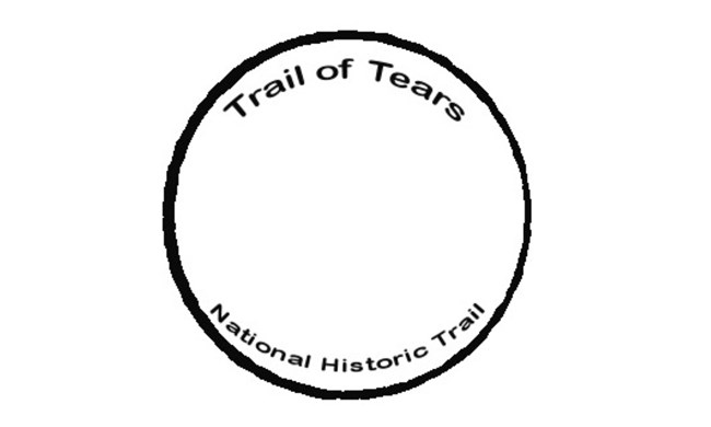 Trail name in black, small text, on the inside of a black circle.