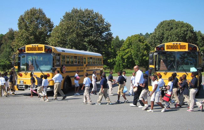 Two busses loading students