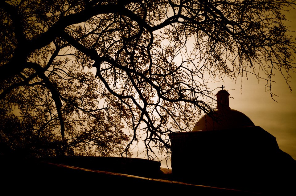 sepia-toned sky with church and trees