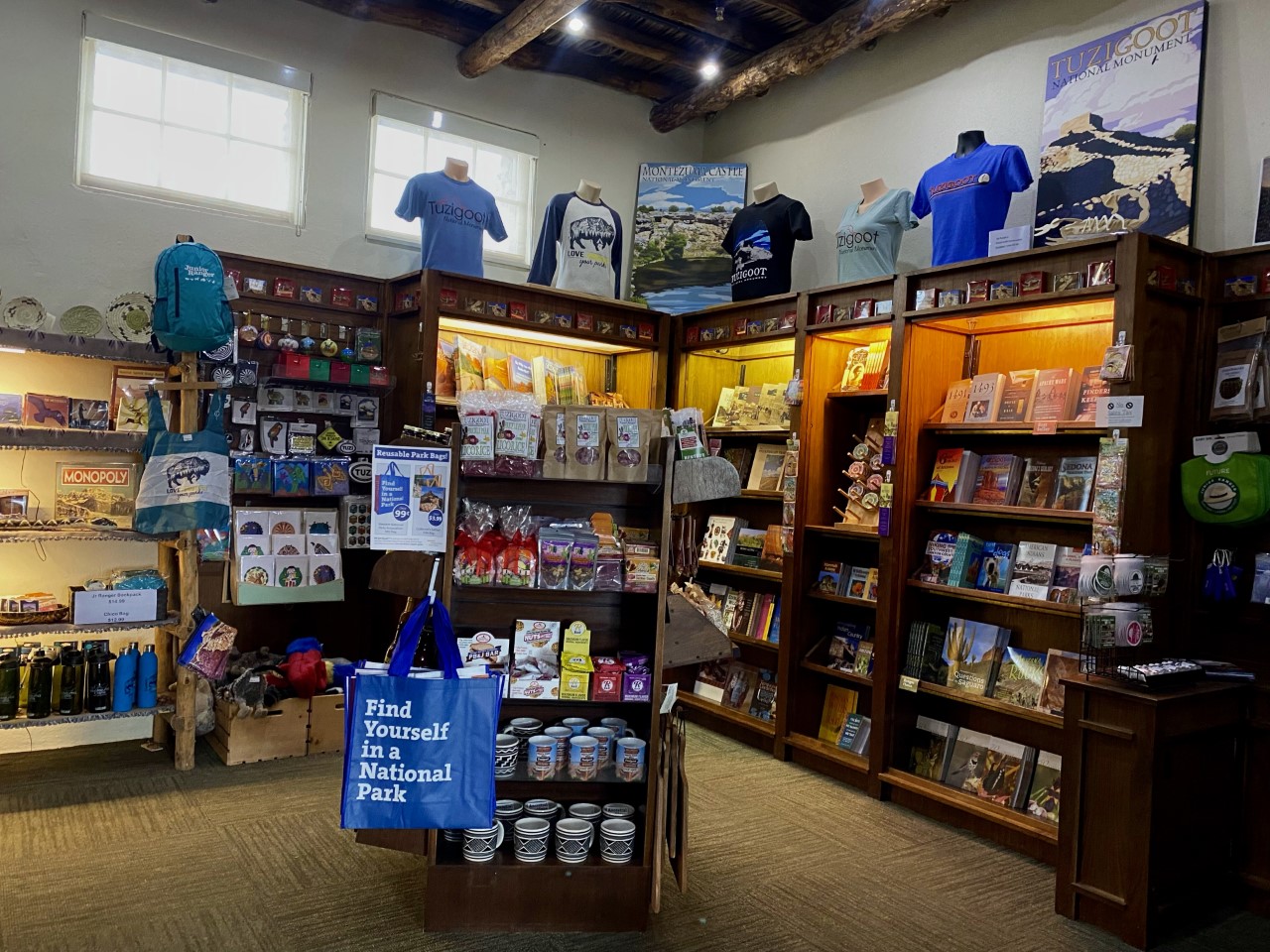 photo of the WNP bookstore at Tuzigoot filled with shelves of books, stickers, snacks, bags, shirts, and other merchandise