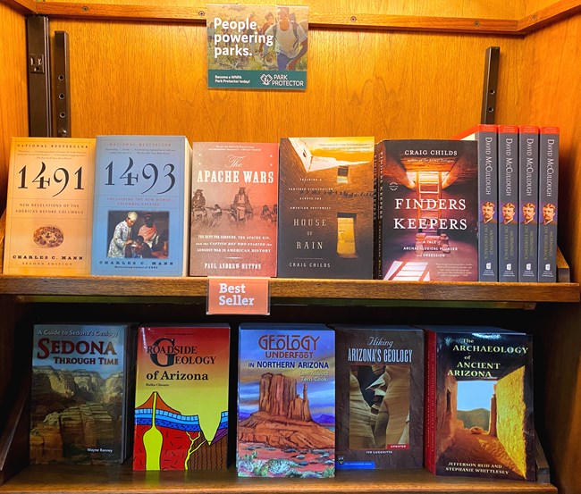 a bookshelf with books for sale featuring topics on geology and history