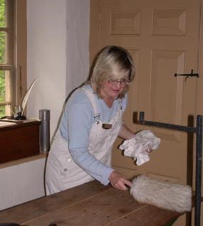 Volunteer assisting curatorial department with historic cleaning.