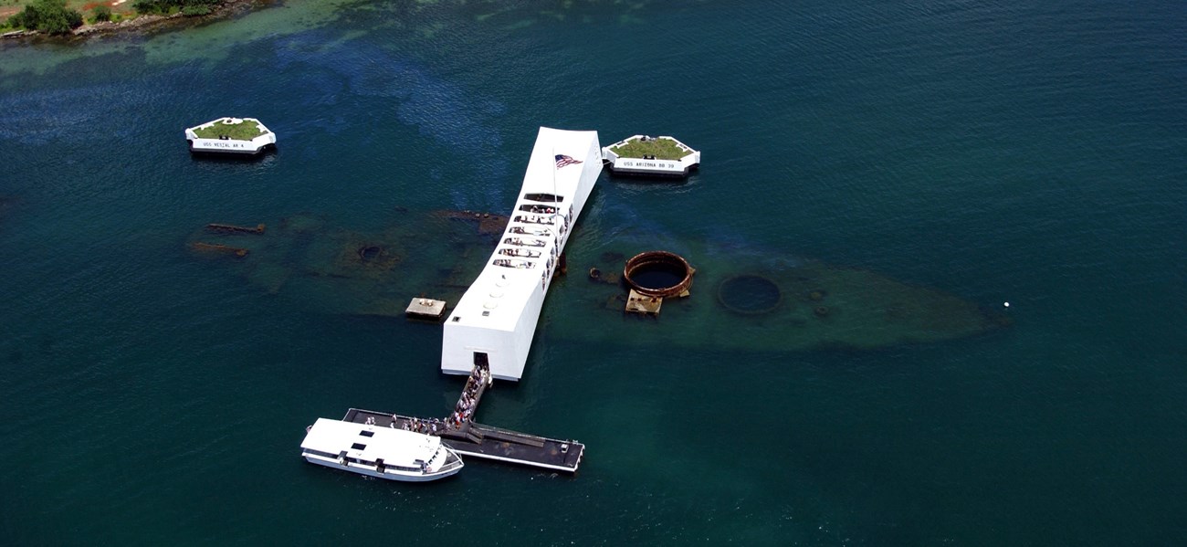 An aerial view of the USS Arizona and the memorial.