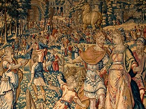 A tapestry illustrating a soldier in armor with outstretched arms and a large horse in the distance.