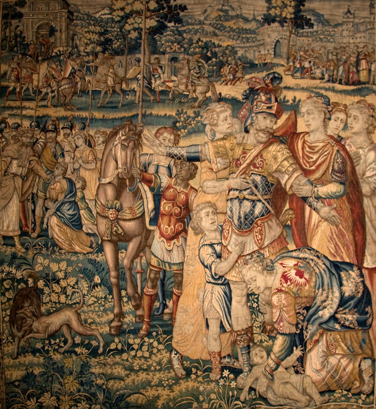 A large tapestry illustrating figures in a landscape.