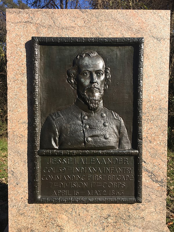 A bronze relief portrait of Jesse Ianthus Alexander