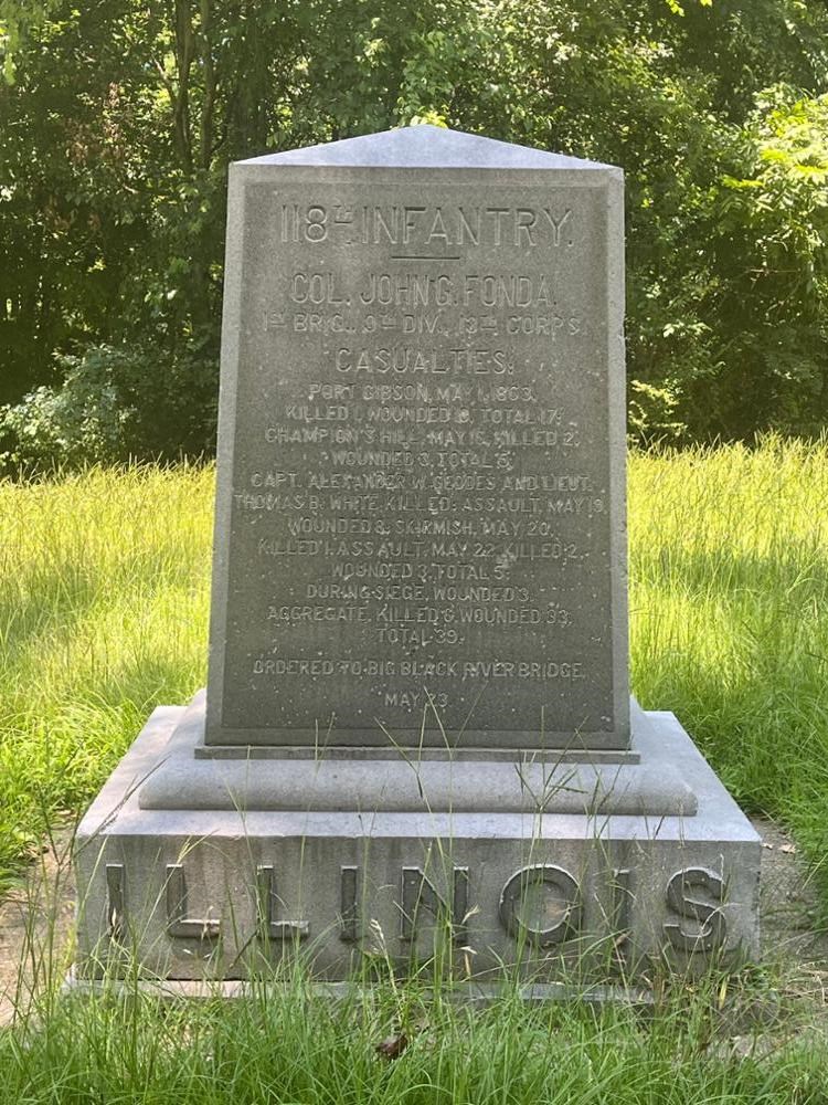 Square rectangular monument with ILLINOIS written on its base