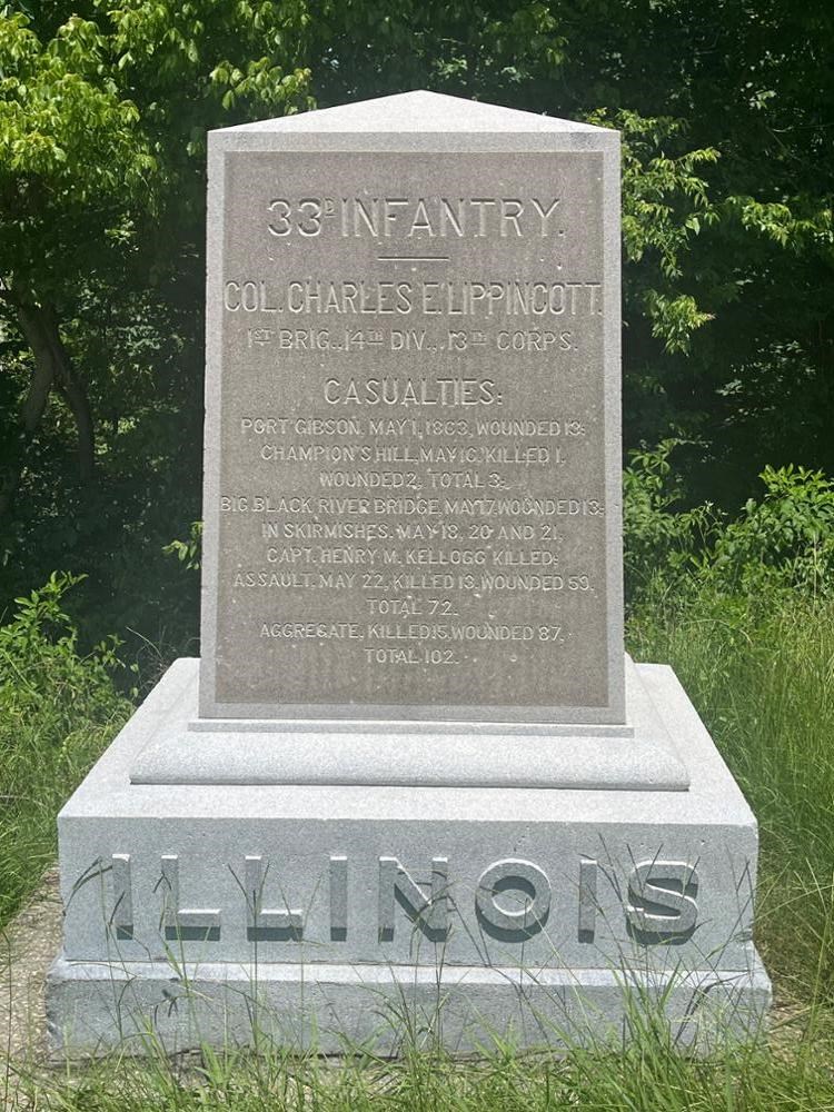 Square Rectangular stone monument with ILLINOIS written on its base