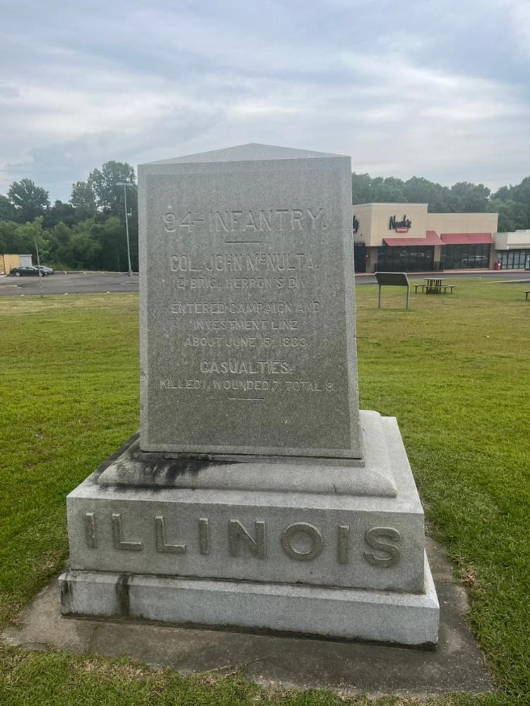 Square Rectangular stone monument with ILLINOIS written on its base