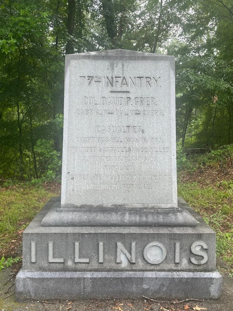 Square Rectangular stone monument with ILLINOIS written on its base