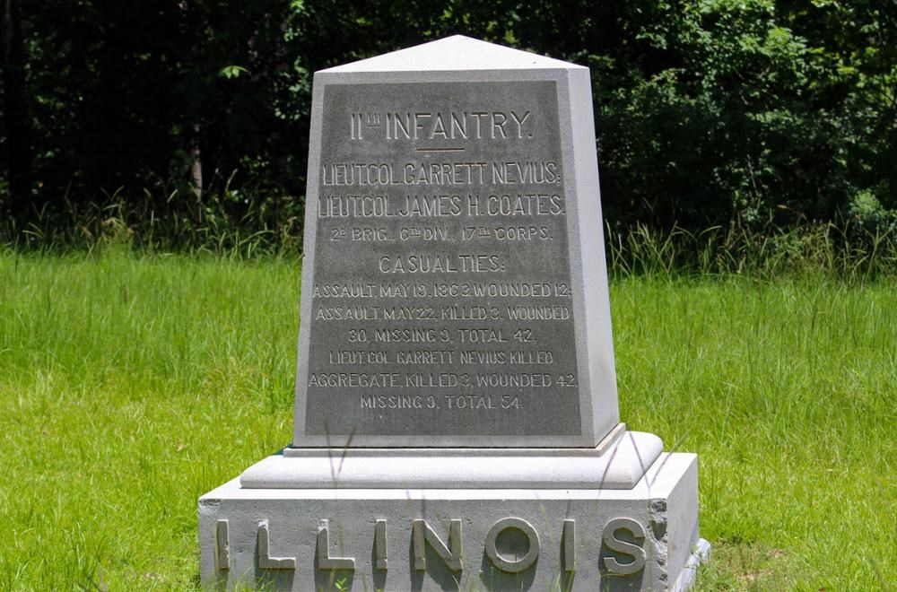 Square Rectangular stone monument with ILLINOIS written on its base