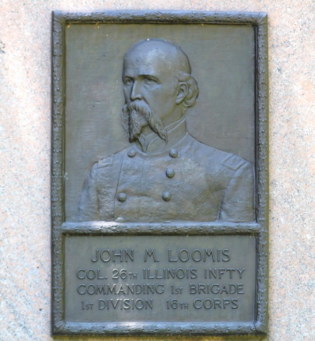 A bronze relief portrait of Col. John M. Loomis