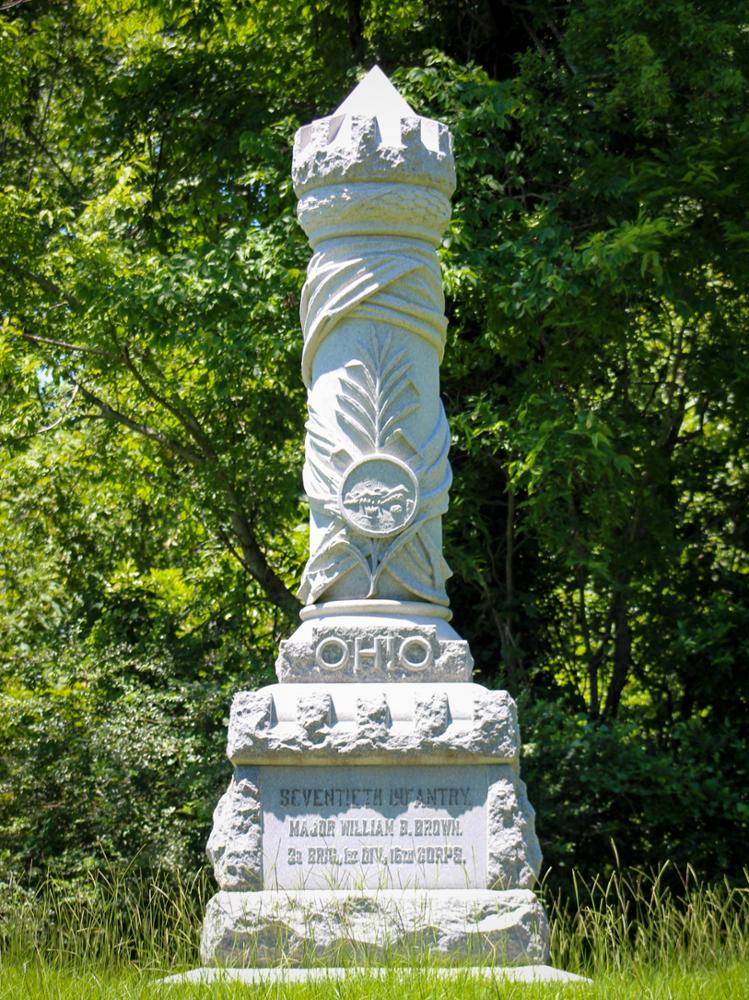 Tall cylindrical stone monument with a pointed top. Inscription: OHIO / Seventieth Infantry. / Major William B. Brown. / 3d Brig., 1st Div., 16th Corps.