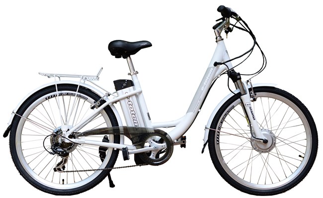 A white bicycle with electric motor.