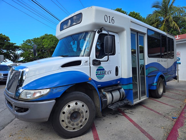 Image of a blue and white bus.