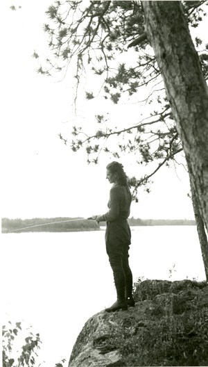Historical Photo:  Lady fishing from rock