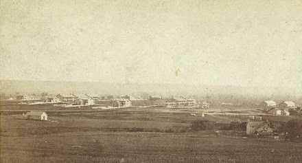 1867 Photograph of Fort Riley, Kansas, showing cluster of buildings on wide open Great Plains
