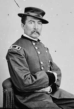 General Sheridan, from 1860's photograph shows him with mustache and arms folded.