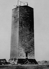 The unfinished Washington Monument with construction equipment on top.