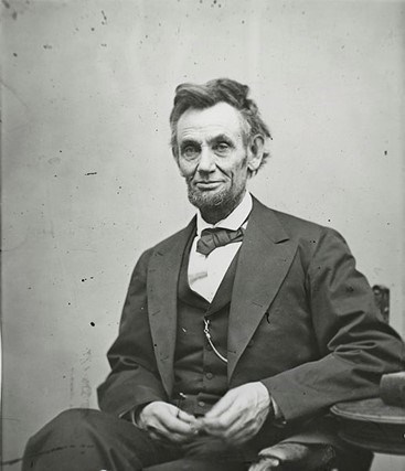 Abraham Lincoln seated for a portrait