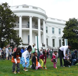 Children rolling Easter eggs on South Lawn
