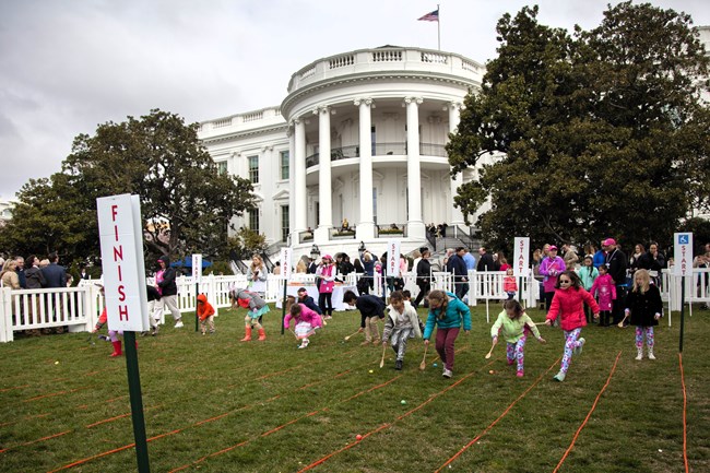 Children rolling Easter eggs on the South Lawn
