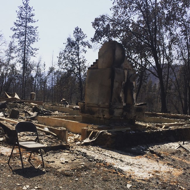 The remains of a park residence after burning to the ground in the Carr Fire. NPS Photo.