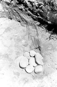 Round stones in hole.