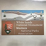 A sign reads “White Sands National Monument, National Parks Association”