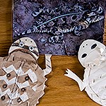 Image of a horny toad and two crafted horny toads made of paper.