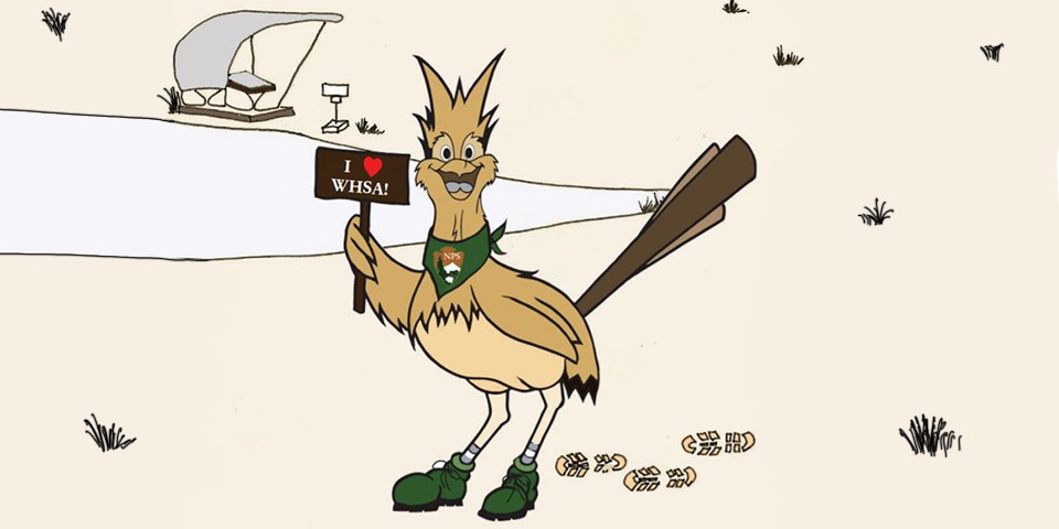 Cartoon image of brown and tan bird in green hiking boots holding a brown sign that says “I heart WHSA”.