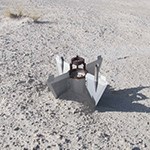 Missile debris in sand.