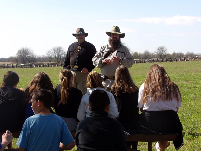 VIPs Tom Anglin and Nick Sackreiter give an education program in 19th century living history clothes.