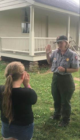 A ranger giving the junior ranger pledge