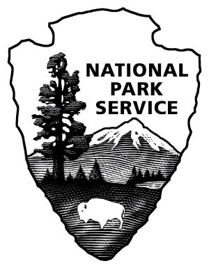 The National Park Service arrowhead logo showing a bison, trees, mountains and water