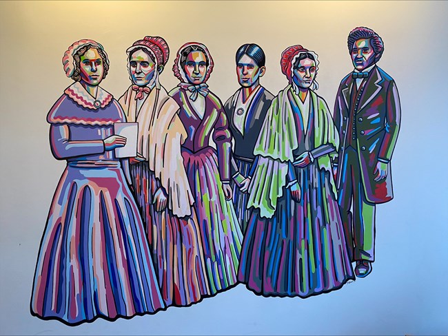 Mural of 5 women and 1 man standing together