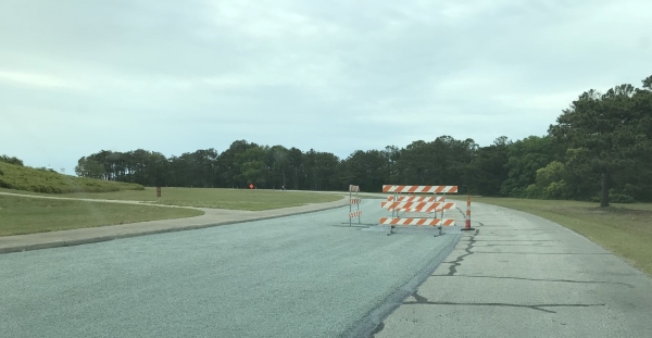 Photo of chip and crack sealing on road at Wright Brothers National Memorial.