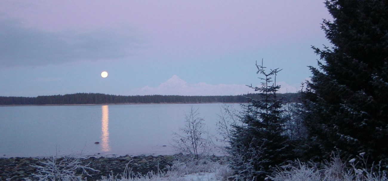 The moon rises over Mt. St. Elias.