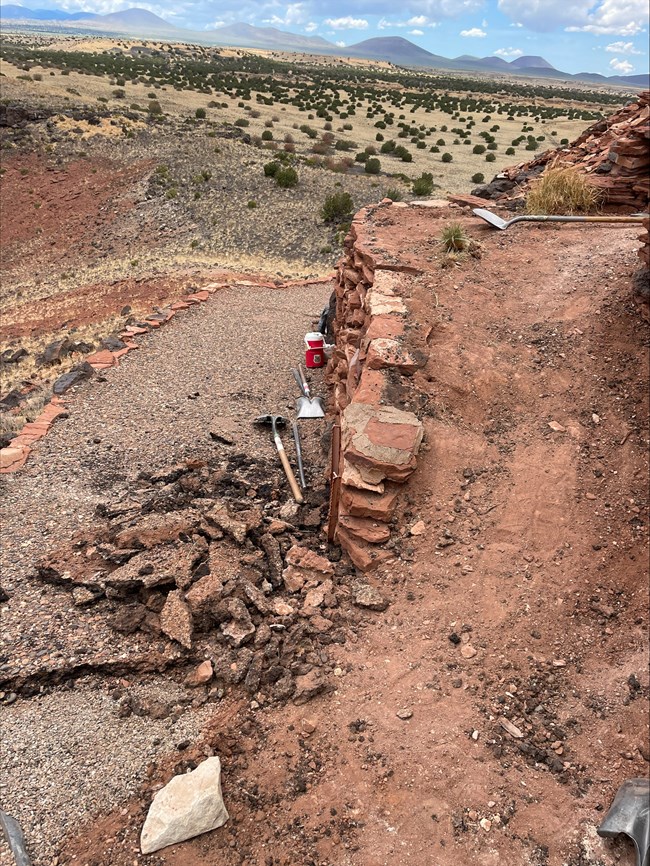 A trail under construction with tools