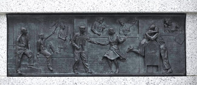 Image of Bas Relief: People dancing in the streets and kissing during Victory in Japan Day.