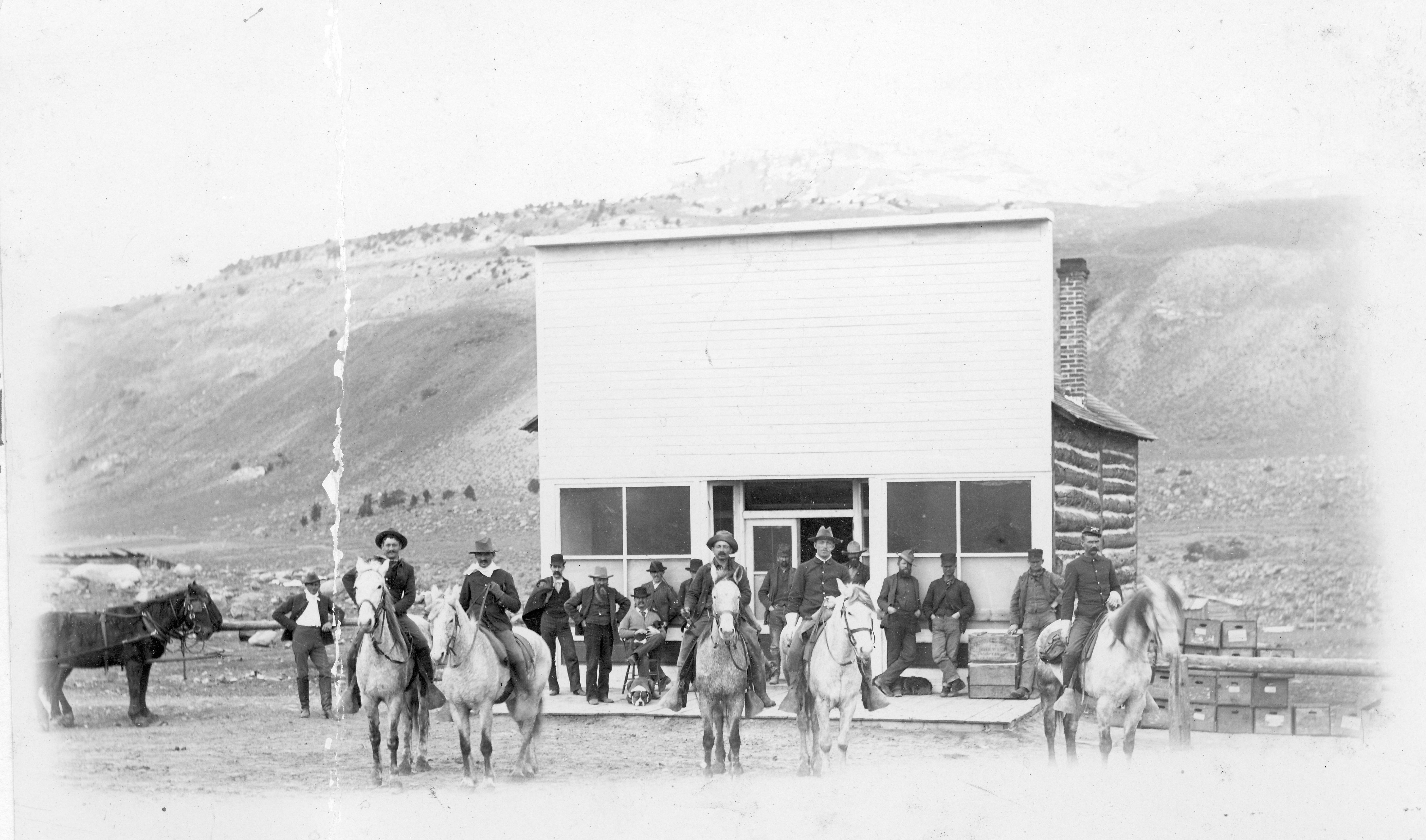 Picture of men gathered around a saloon