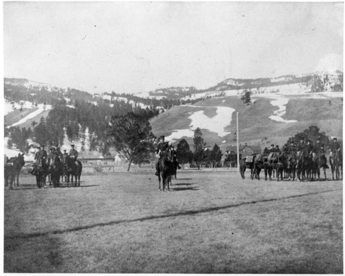 Images of military men on horseback in a field, with snowy mountains in the background.