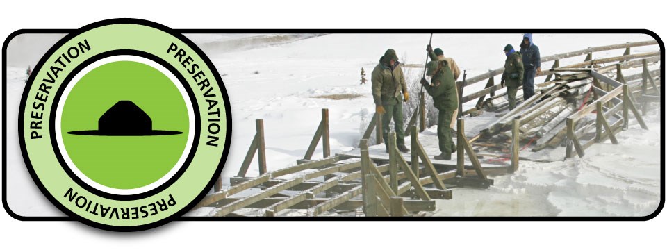 Green preservation badge with a silhouette ranger hat over a scene of NPS employees fixing a boardwalk in winter.