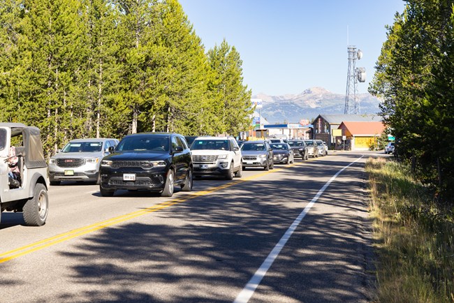 Traffic backing up from West Entrance into town