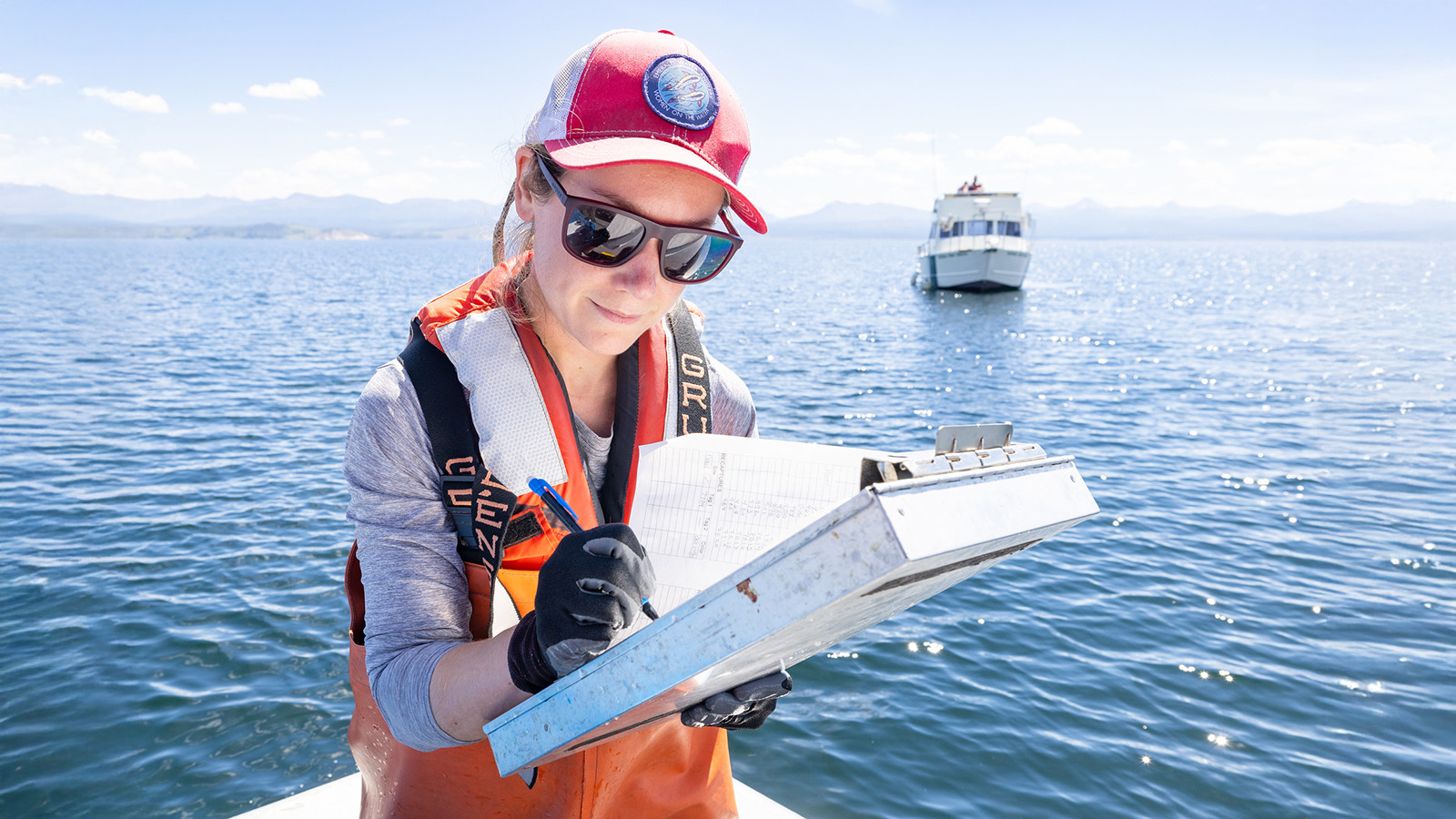 Michelle Briggs, Ph.D. candidate, documenting Yellowstone cutthroat measurements