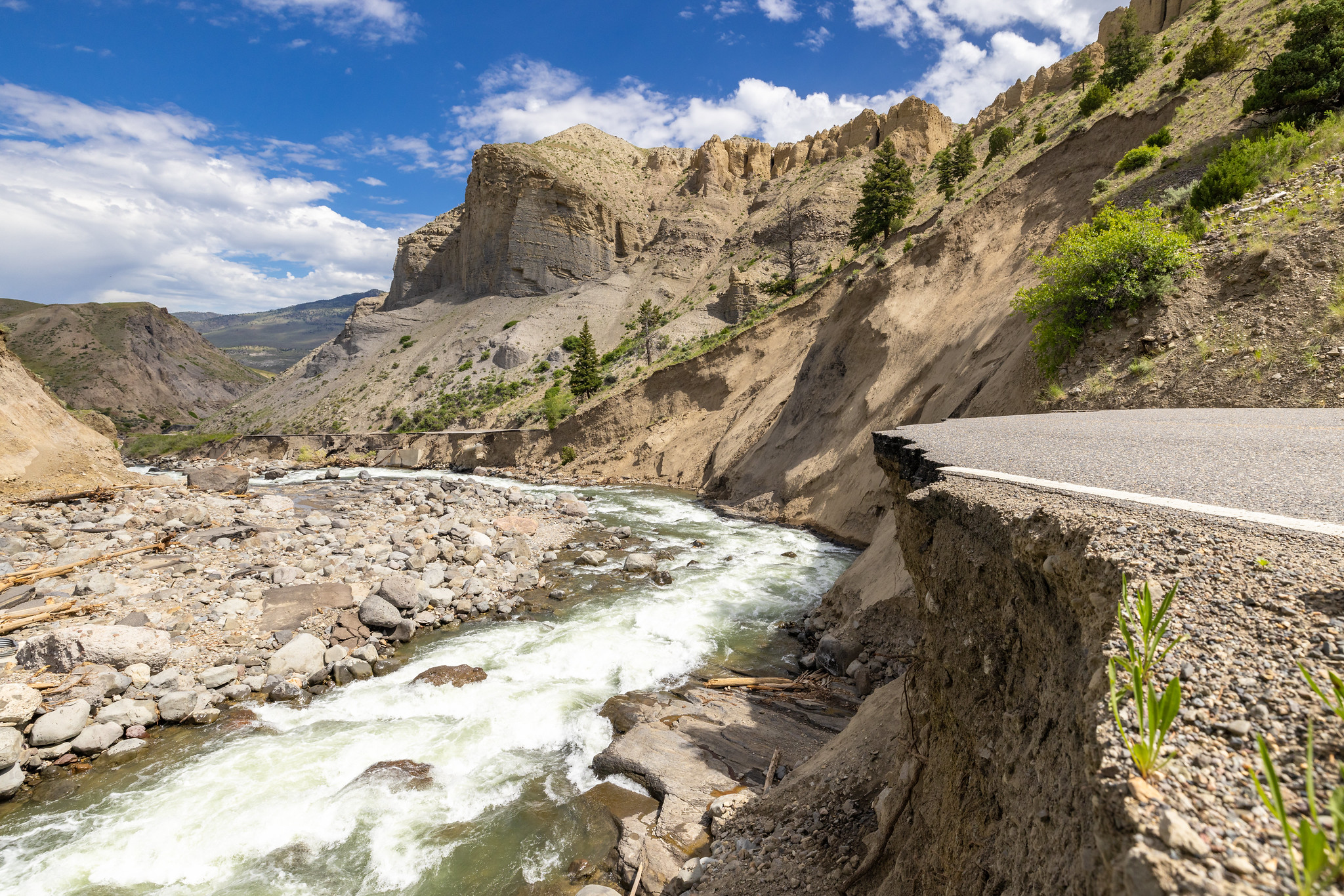 Yellowstone flood event 2022: Impacts to road in Gardner River Canyon from below road level