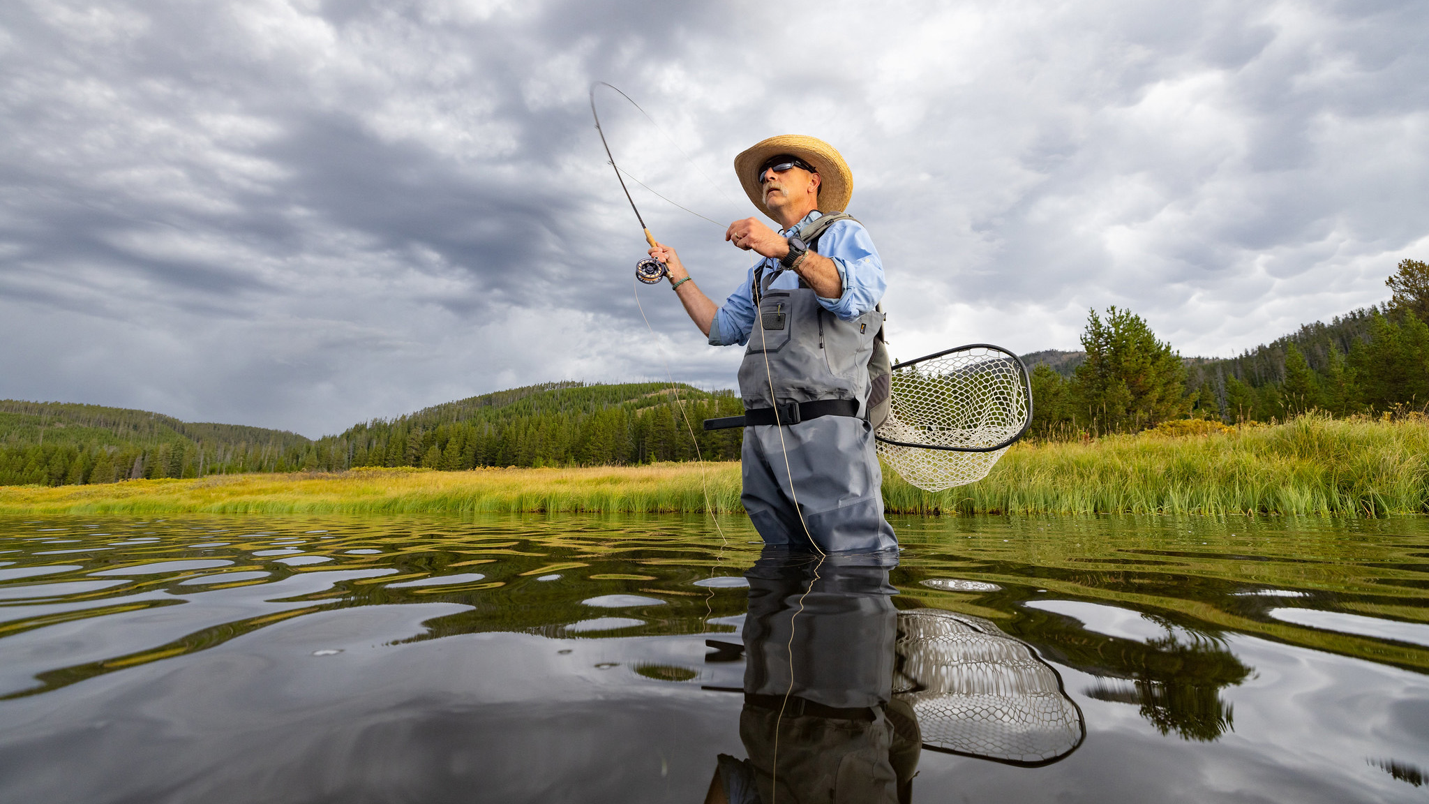 Flyfishing at Grebe Lake under a stormy sky